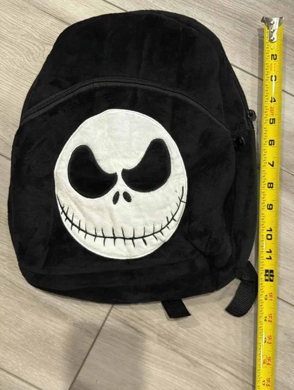 Black Plush Backpack with Jack Skellington Face Design
